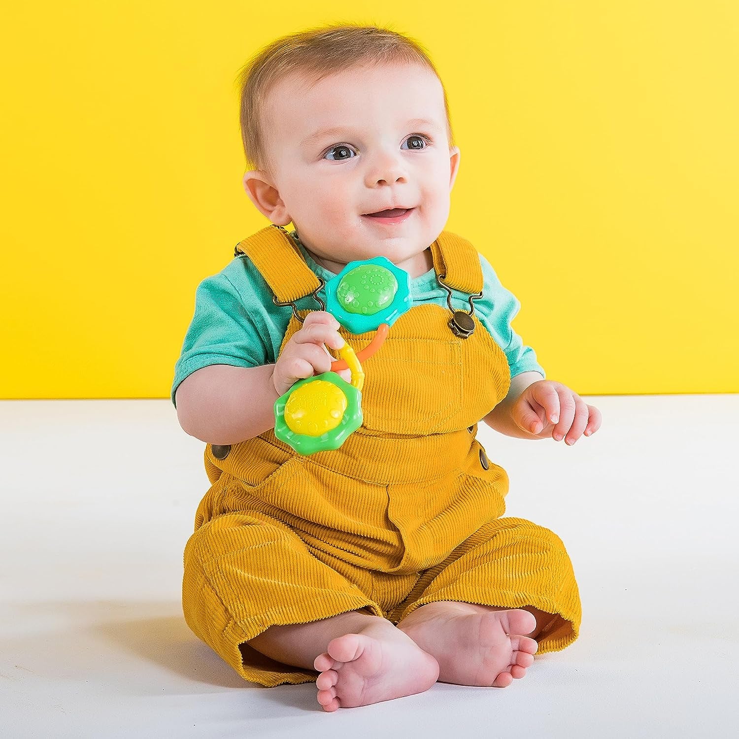 "Fun and Stimulating Rattle & Shake Barbell Toy for Babies 3 Months and up - Vibrant Green Color!"