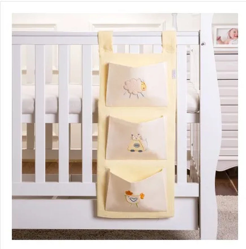 "Organize and Simplify: Baby Bed Hanging Storage Bag for Crib Bedding Set - Perfect for Toys, Diapers, and More!"