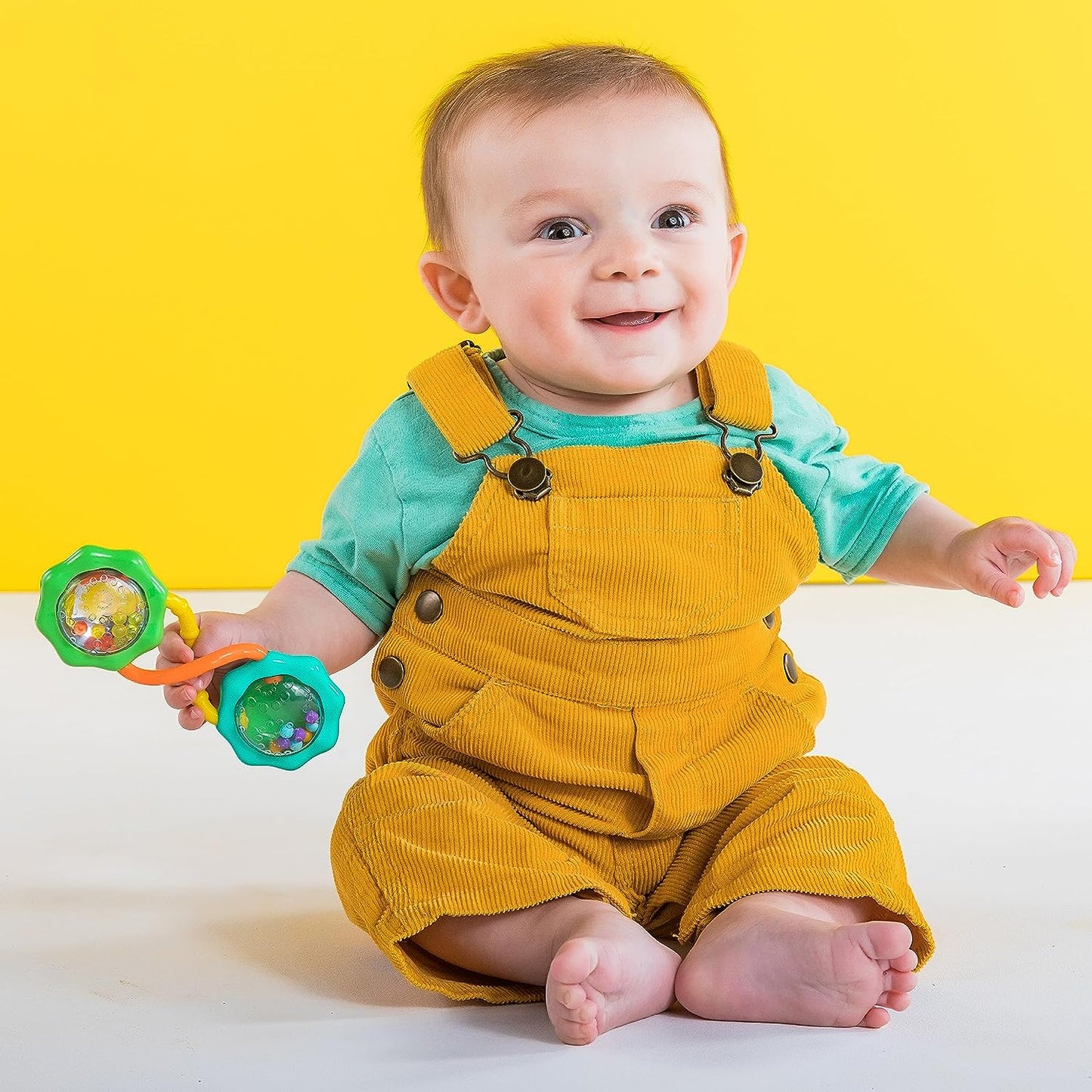 "Fun and Stimulating Rattle & Shake Barbell Toy for Babies 3 Months and up - Vibrant Green Color!"